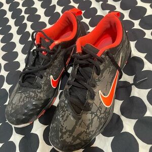 Nike Black and Redish Orange rubber spike cleats, size W7.5